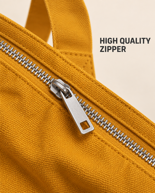 Close-up of the mustard tote bag silver-tone zipper