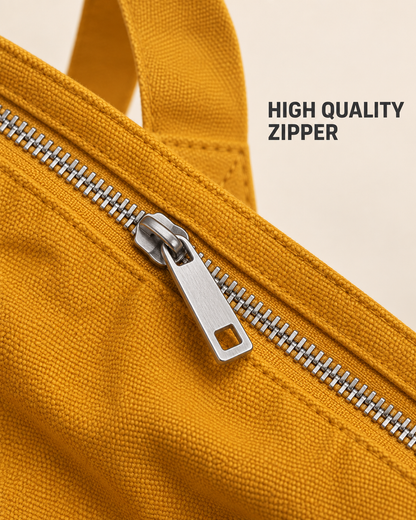 Close-up of the mustard tote bag silver-tone zipper