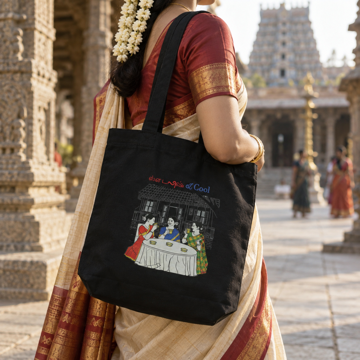 Woman carrying the black Stylish and Cool tote bag at a South Indian temple